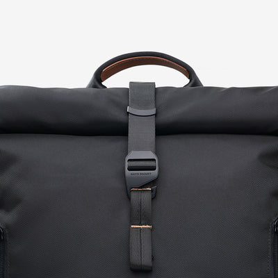Close-up of side release buckle clip on NayoSmart Urban U8 black roll-top backpack, quick-access main compartment fastener detail