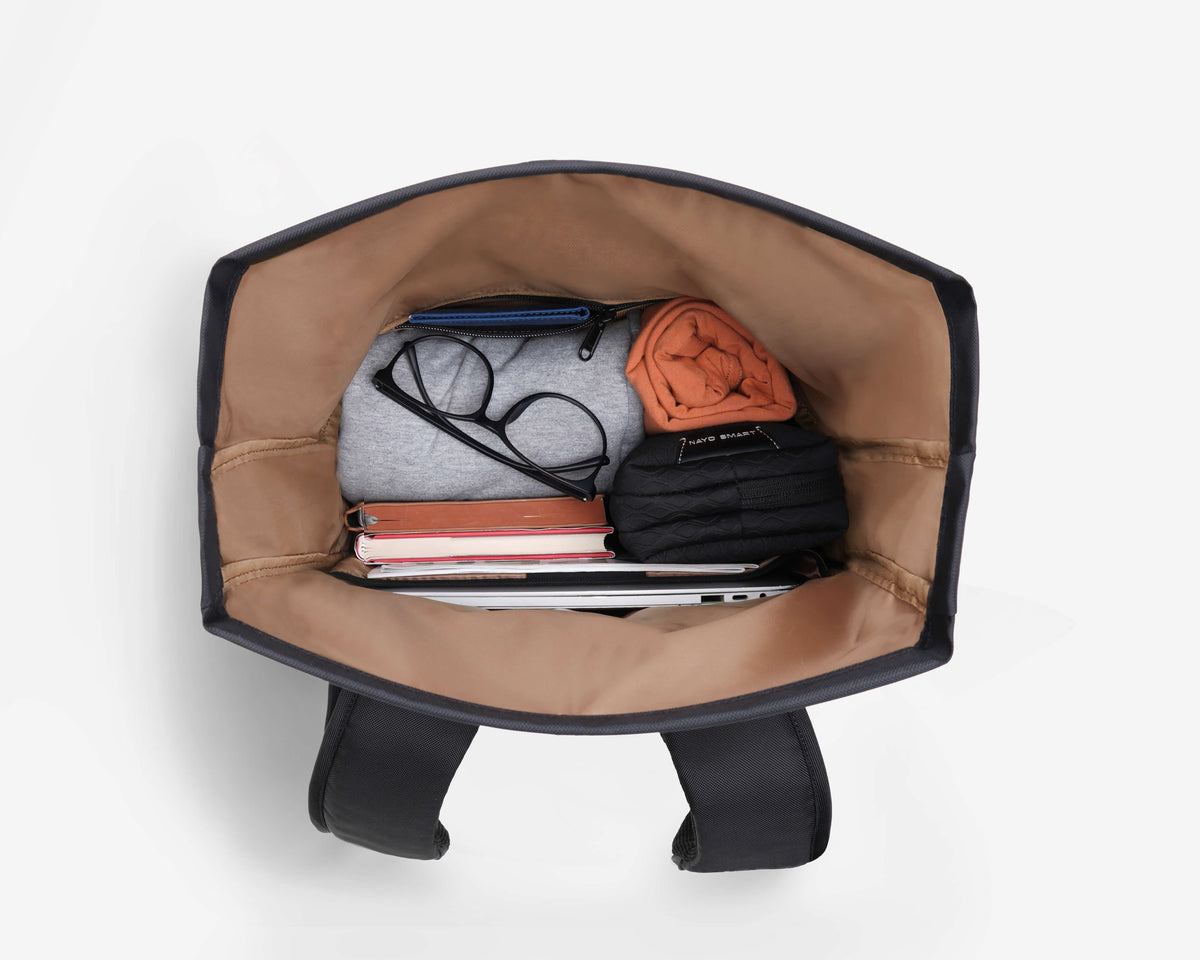 Top-down open main compartment of NayoSmart Urban U8 black roll-top backpack, internal organization with laptop sleeve and mesh pockets