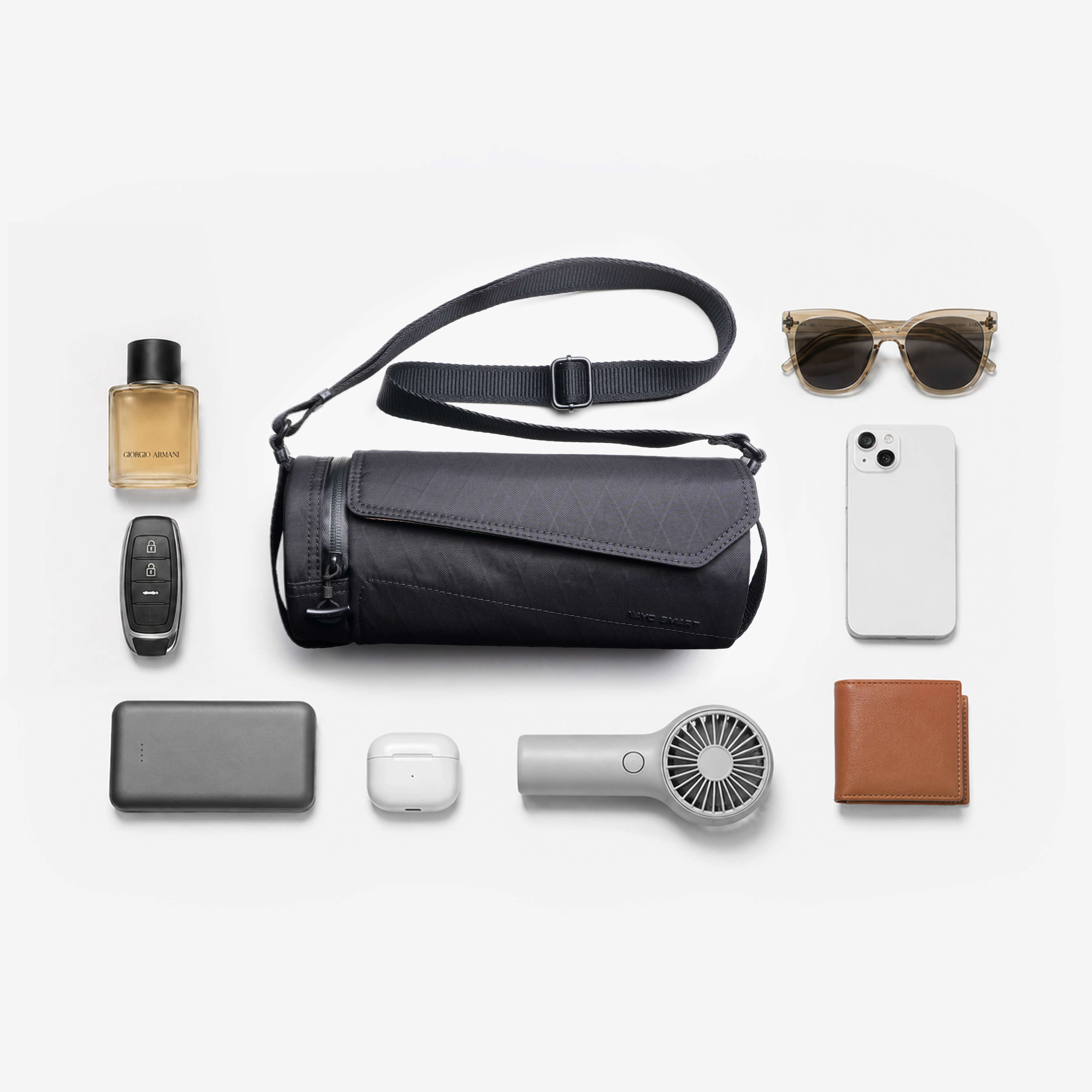 Nayo Smart Urban UL5 Cylinder Sling Bag Black flat lay, everyday carry essentials layout, compact crossbody sling bag