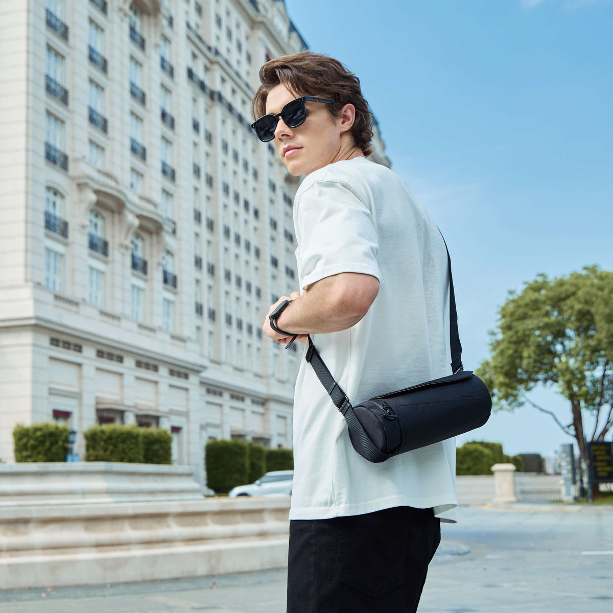 Nayo Smart Urban UL5 Cylinder Sling Bag Black, male model outdoor street wearing crossbody sling bag