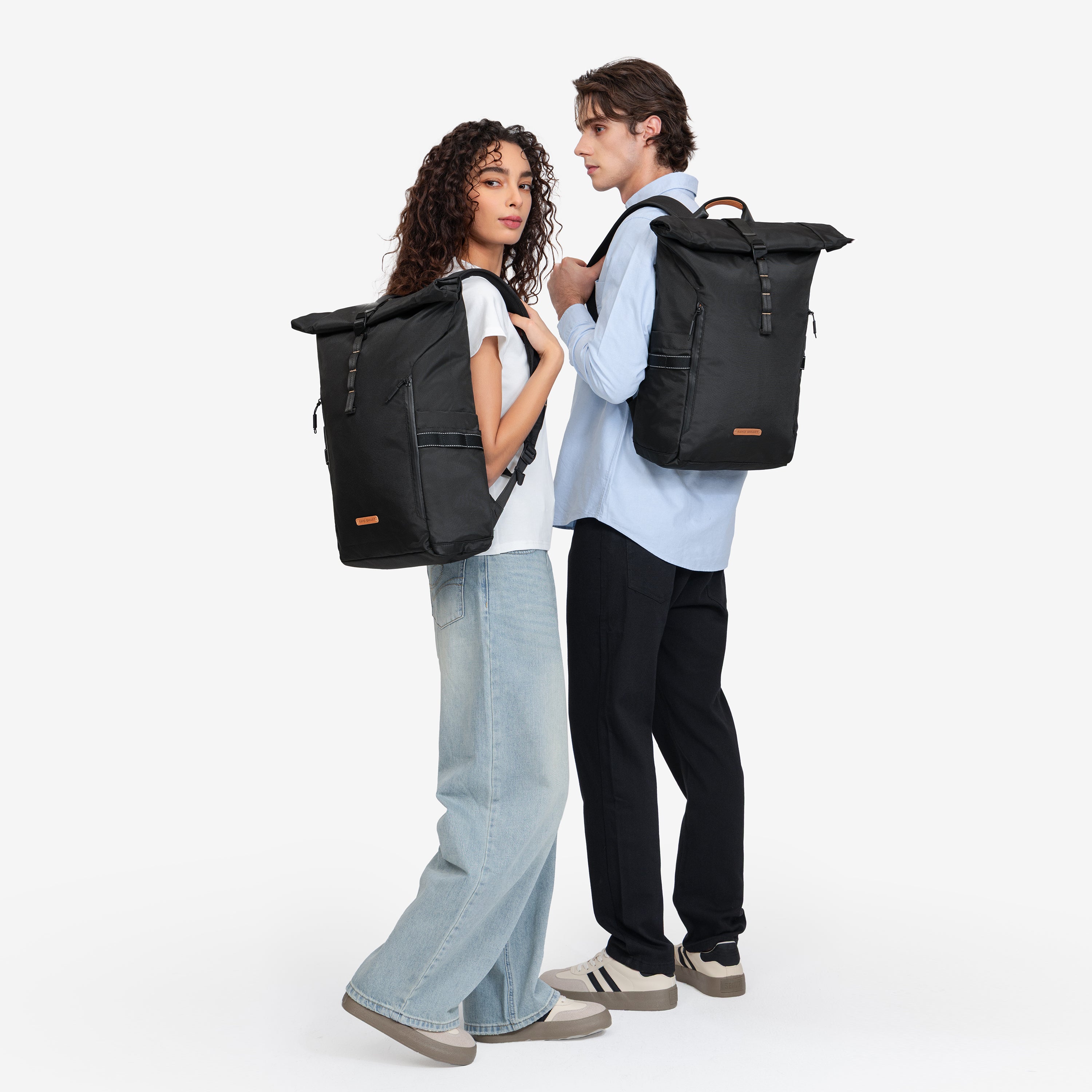 NayoSmart Urban U8 black roll‑top backpack, man and woman wearing backpack side view , unisex commuter travel rucksack fit showcase