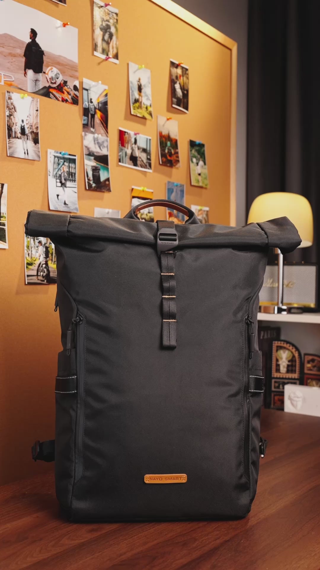 Load video: NayoSmart Urban U8 black roll-top backpack quick packing and organization demo, hands showing internal storage and buckle closure